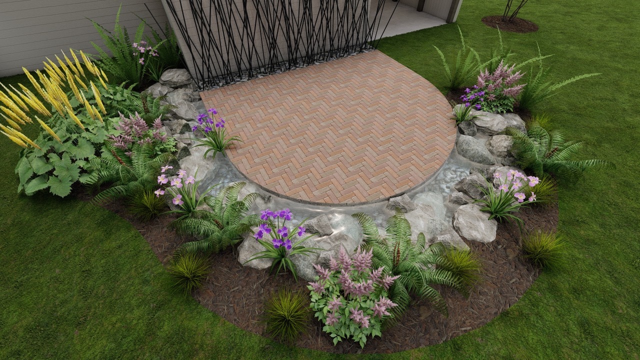 A circular brick patio surrounded by lush garden plants and rocks, creating a serene outdoor space with a small water feature.