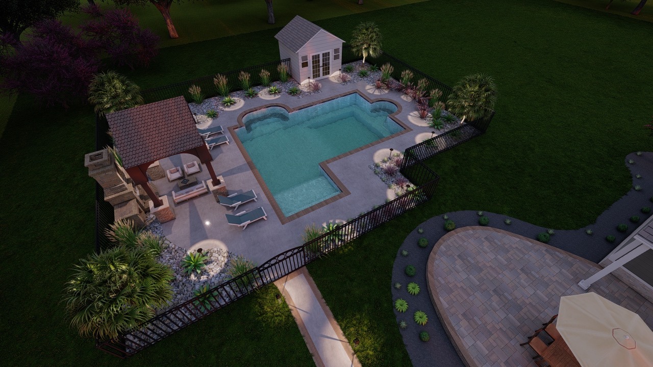 Aerial view of a backyard pool surrounded by greenery, patio chairs, a small pavilion, and a garden path, lit by evening lights.