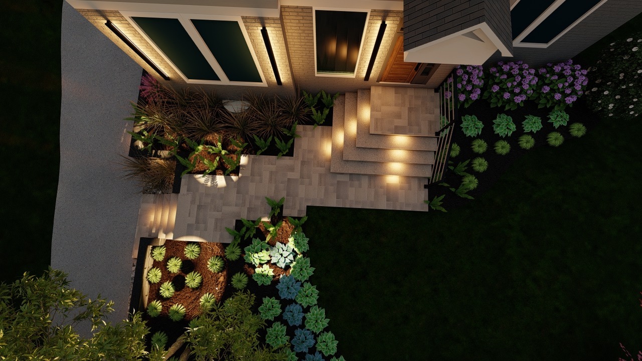 Aerial view of a house entrance with illuminated steps, modern landscaping, and diverse plants arranged in neat, decorative patterns.