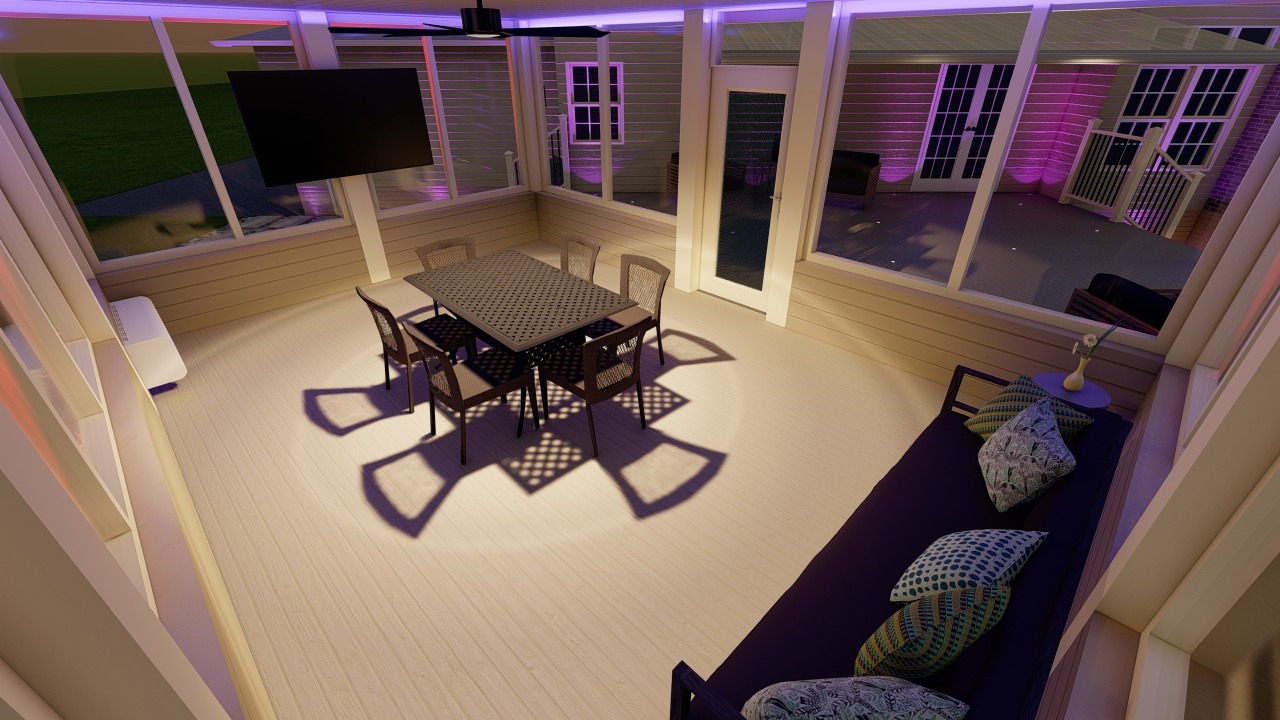 Modern enclosed patio with dining table, chairs, and couch. Large windows, purple accent lighting, and mounted TV create a cozy atmosphere.