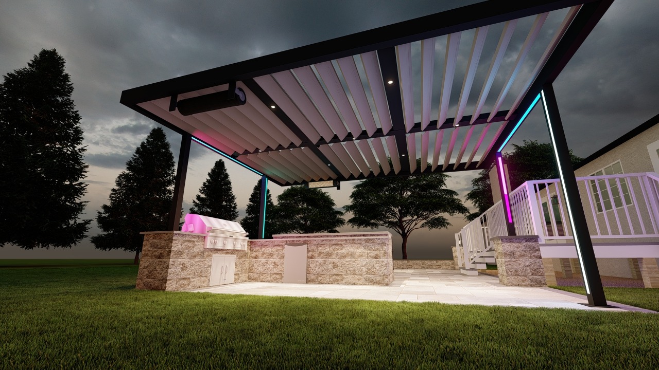 Modern outdoor kitchen with stone countertops and a louvered pergola. Colorful lights illuminate the structure beside a lawn and trees.