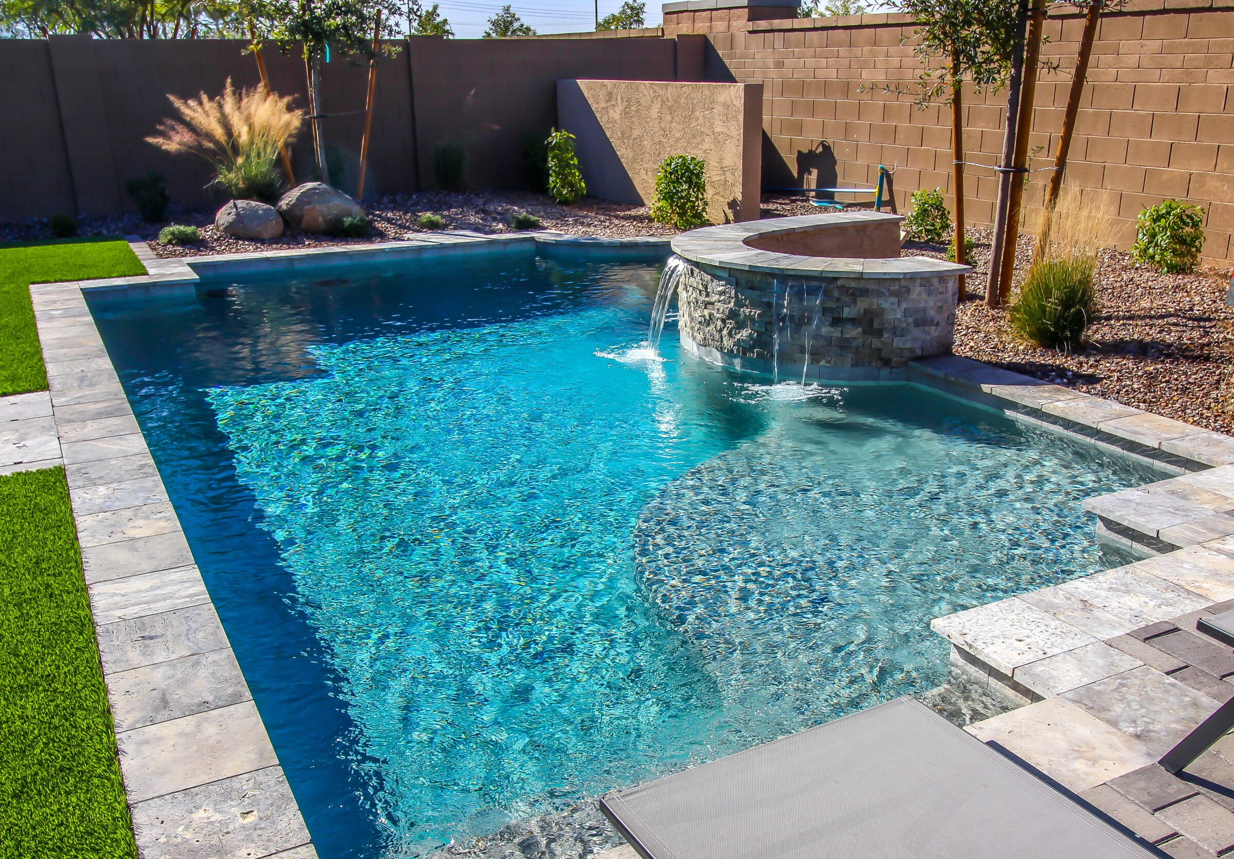 Landscaped Rear Yard Swimming Pool With Waterfall